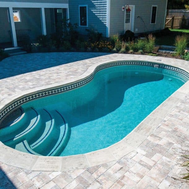 Copano Pools and Spas luxurious fiberglass pool with a clean waterline