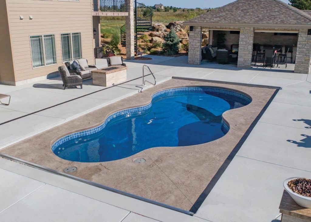 Copano Pools and Spas showing a beautiful finished pool deck